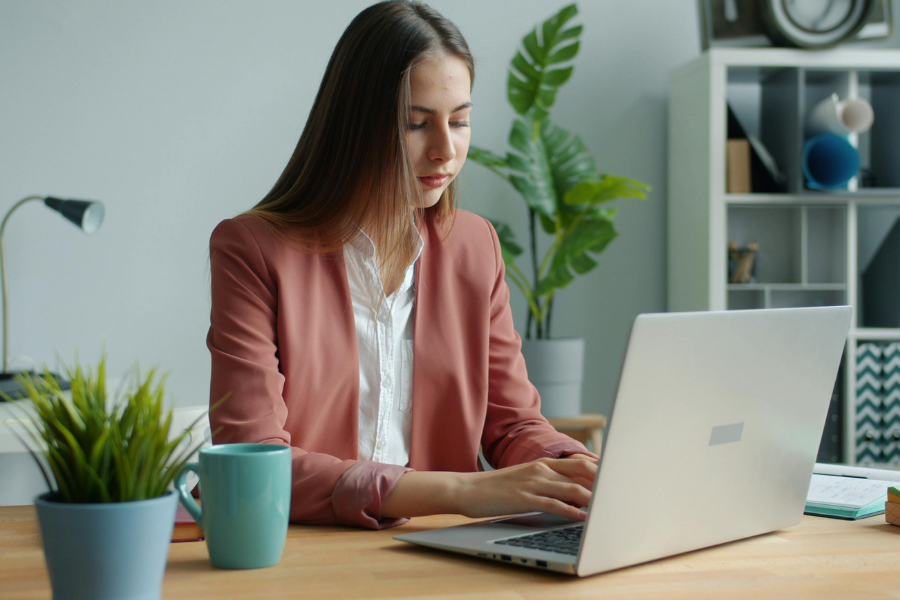 woman invoicing on laptop 